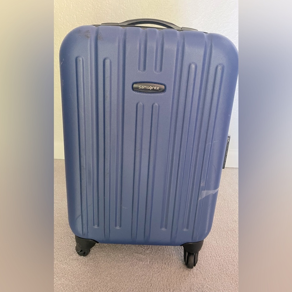 Samsonite blue carry on luggage 18”